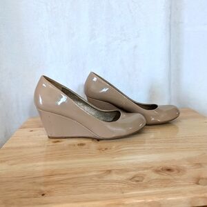 Nude wedge pumps